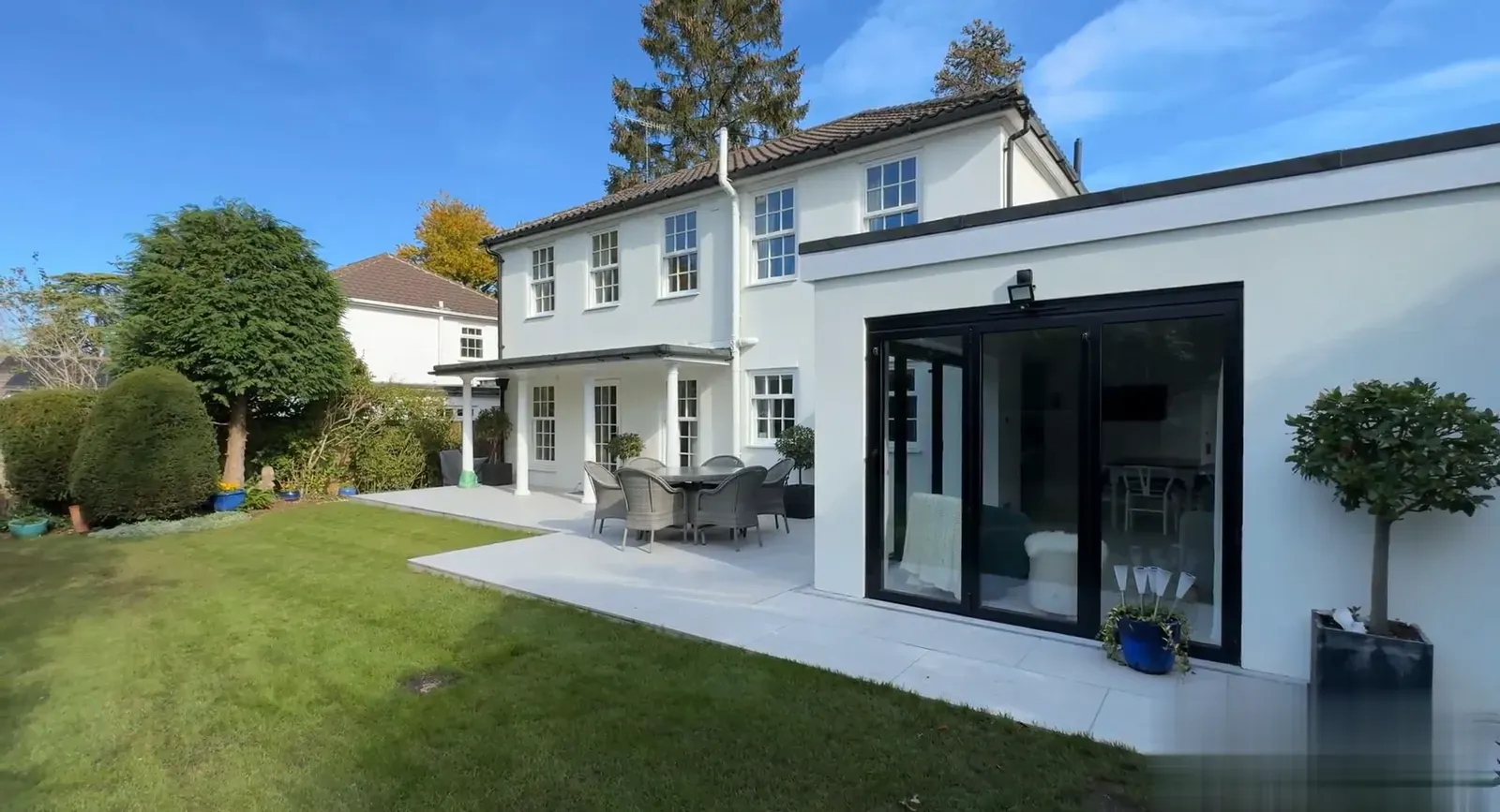 Completed Prestige Surrey renovation: rear garden with new single-storey extension and bifold doors